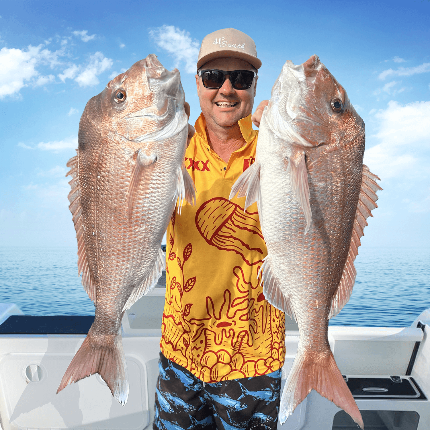 Paul Worsteling from iFish holding two snapper, endorsing Seavu underwater fishing camera system