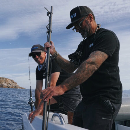 A carbon fibre GoPro extension pole used underwater for fishing and marine filming, showing how to position a camera below the surface for better angles and visibility.